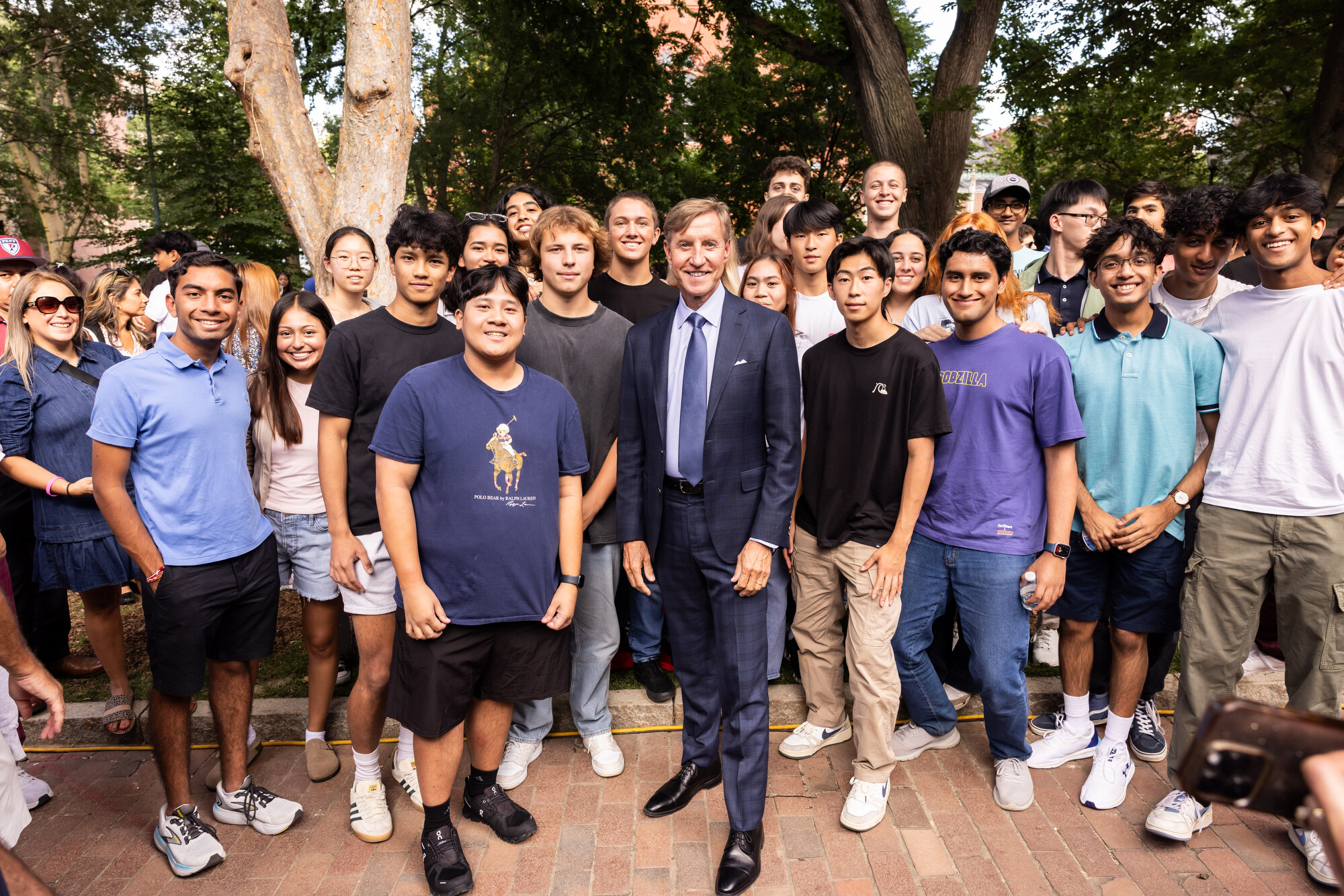 president jameson poses with a group of new students