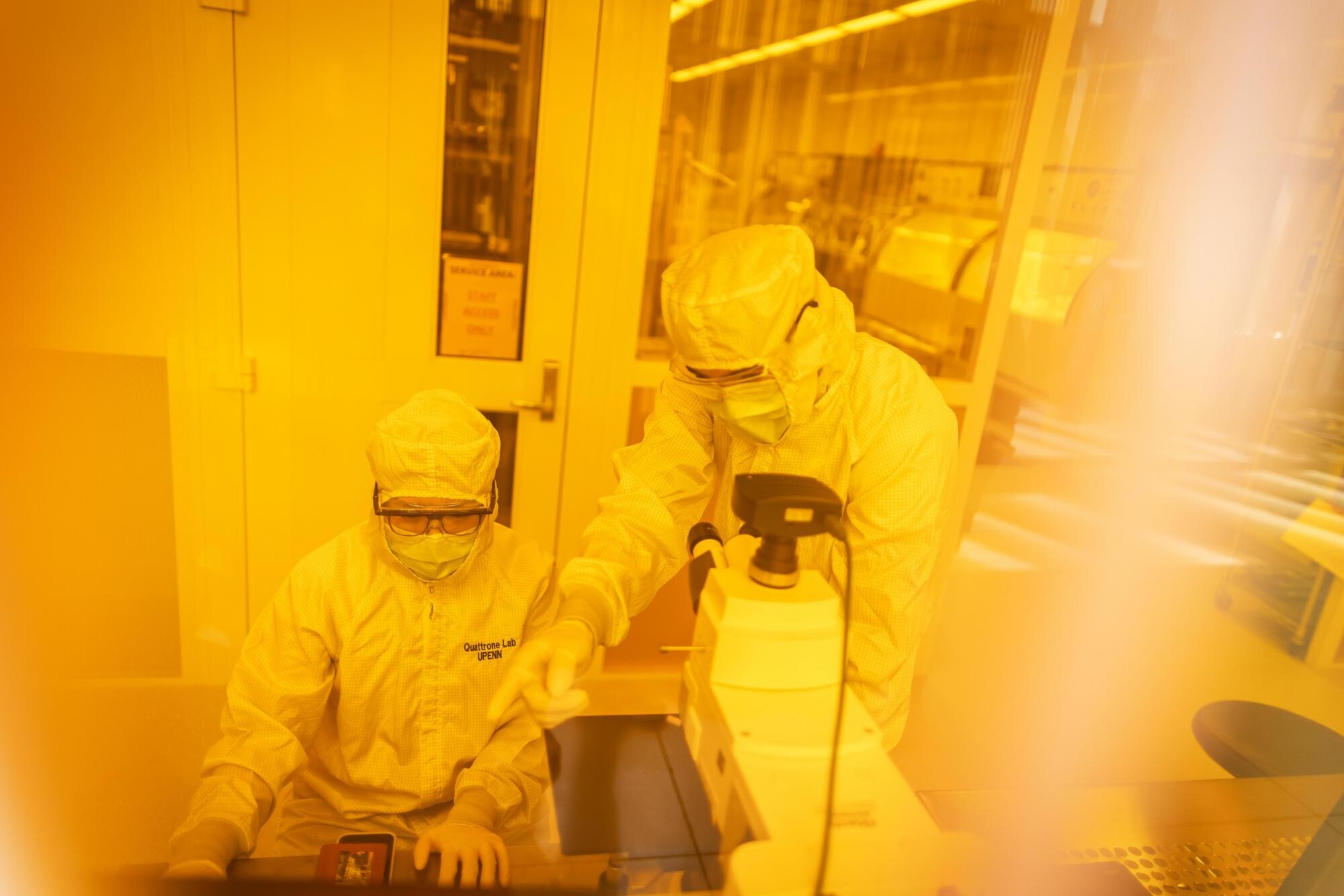 Yue Jiang(left) and Vincent Curler in a lab wearing protective gear.