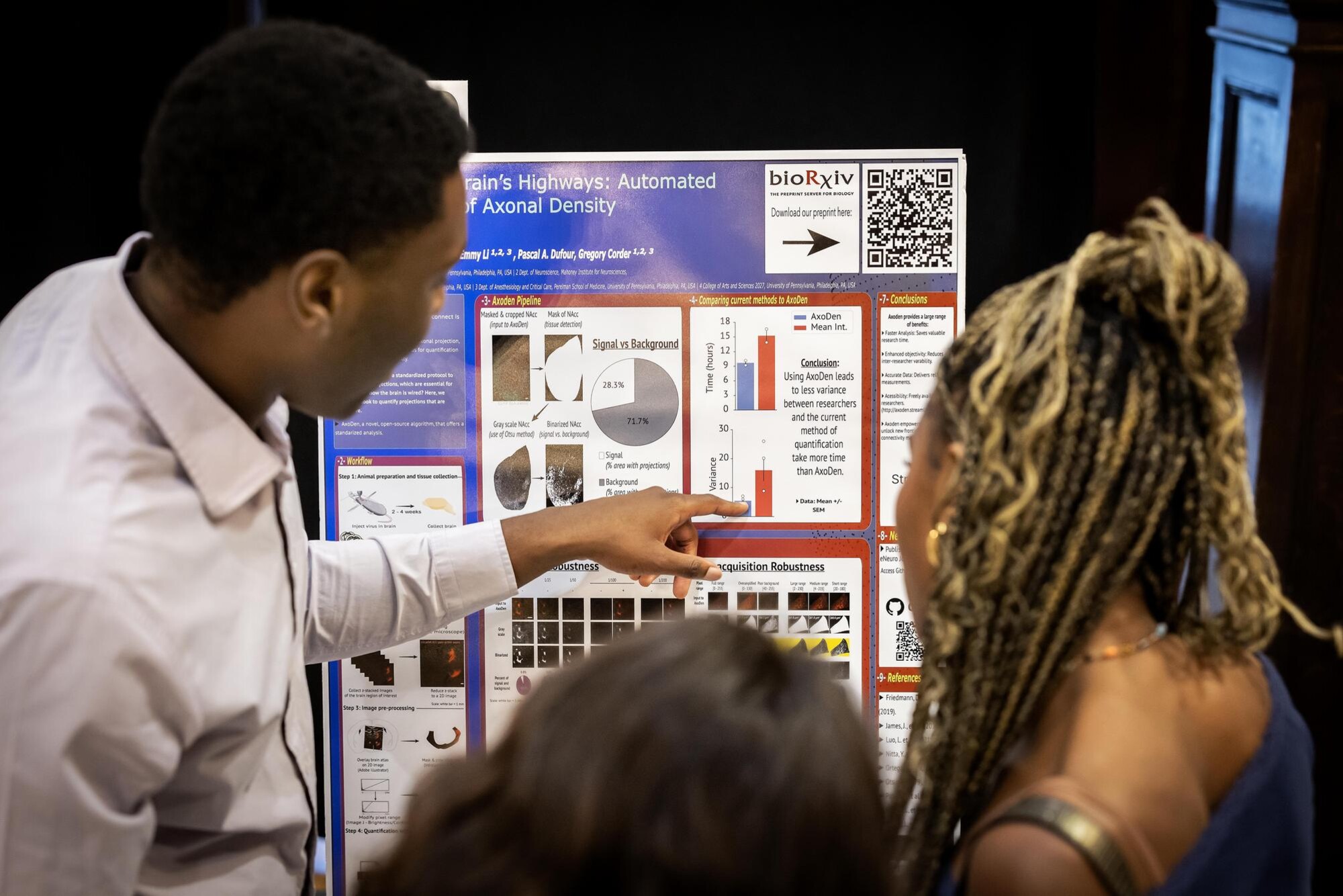 A student talks with an attendee about their poster during Penn’s CURF Poster Expo in Houston Hall.