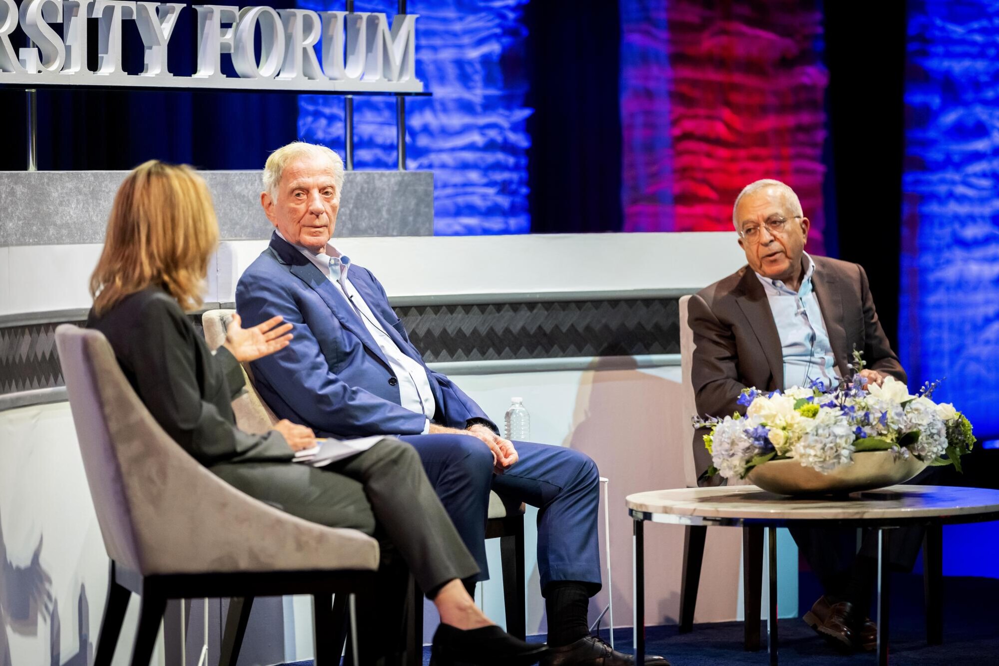 Three panelists on stage at Penn’s Silfen Forum.