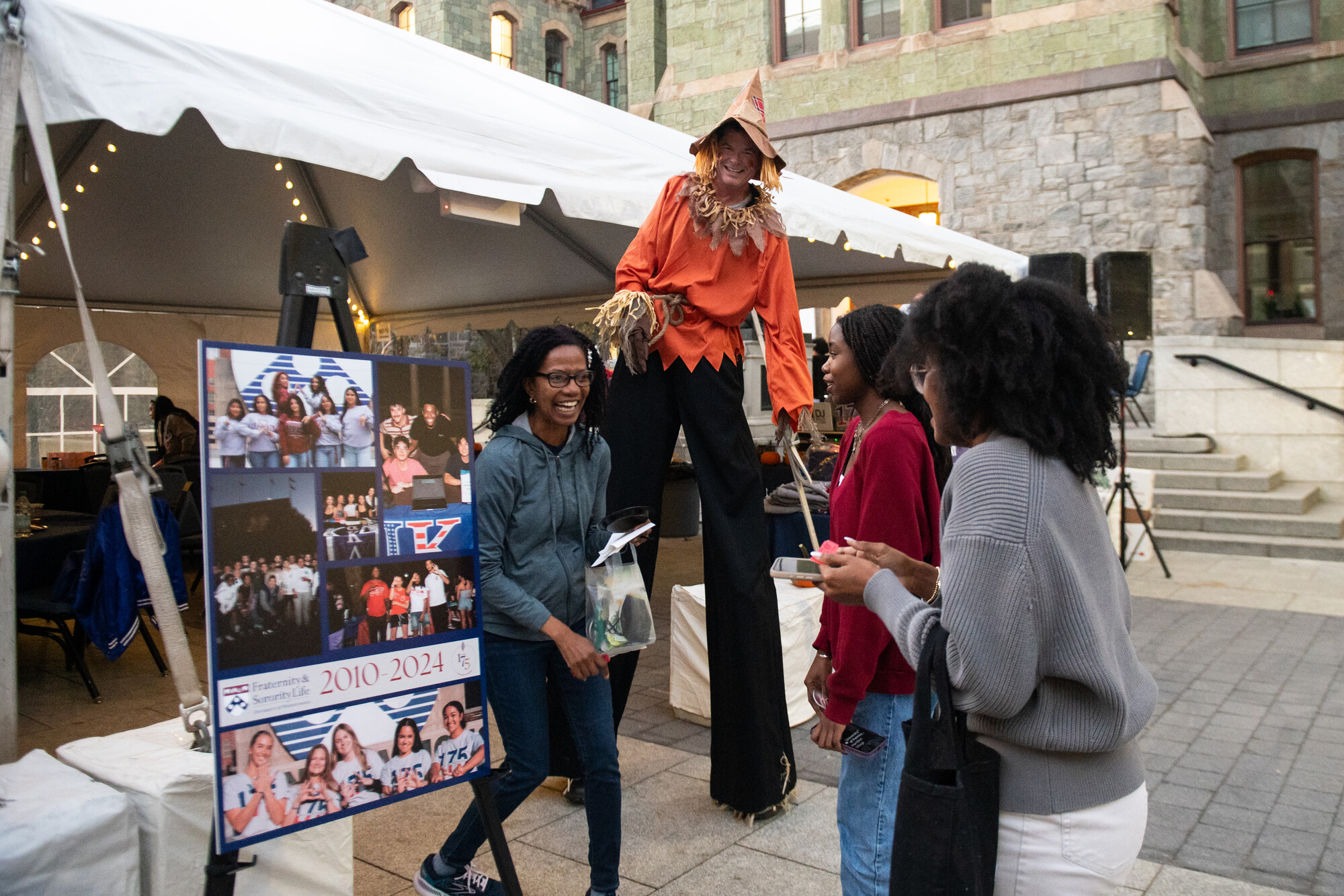 People at a tent during Penn’s Friends and Family Weekend.