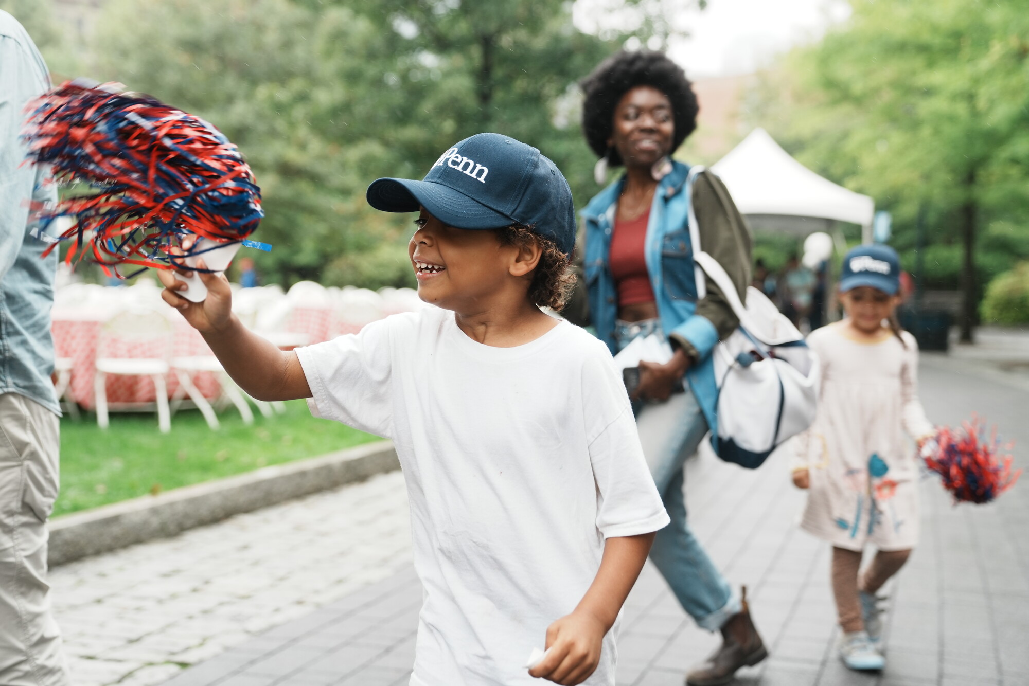 A family on Penn’s campus during Friends and Family Weekend.