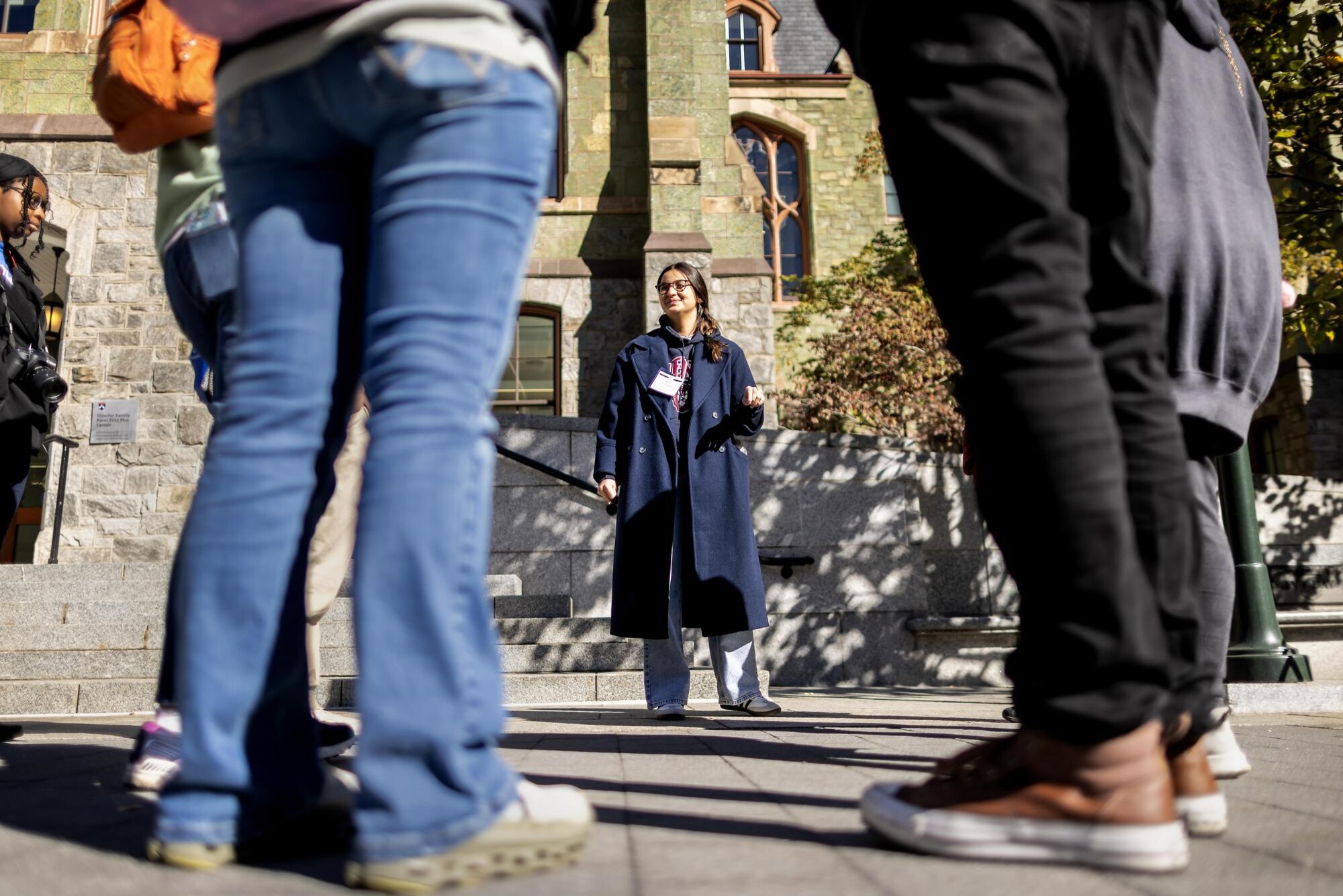 A member of Kite and Key addresses people outside College Hall.