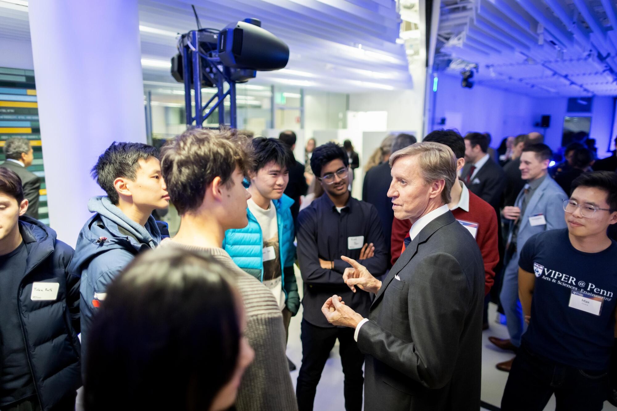 Penn Interim President J. Larry Jameson talks with students at the event.