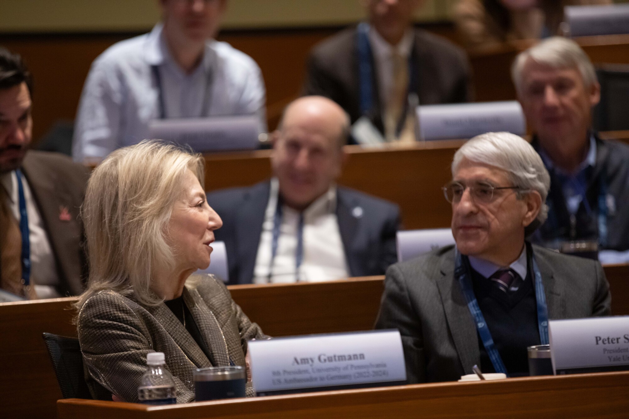 Amy Gutmann seated next to Peter Salovey.