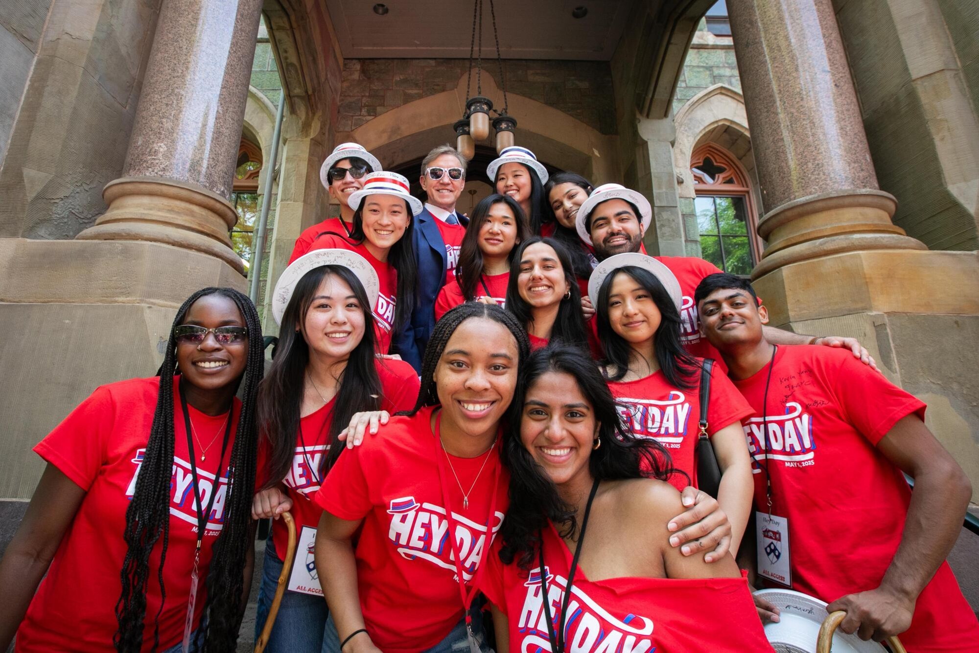 Penn students and J. Larry Jameson on the steps of College Hall during Hey Day.