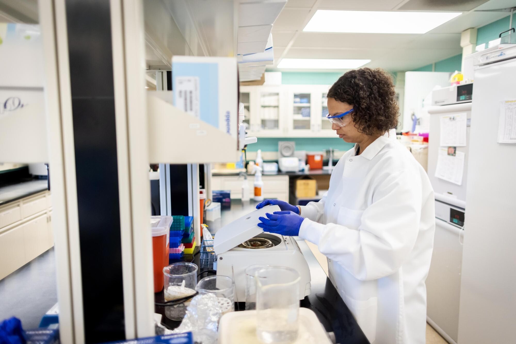 Isis Lawson wearing PPE working in a lab.