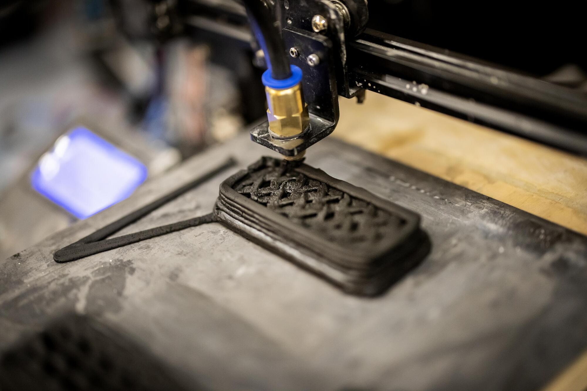 A machine building the object in the lab.
