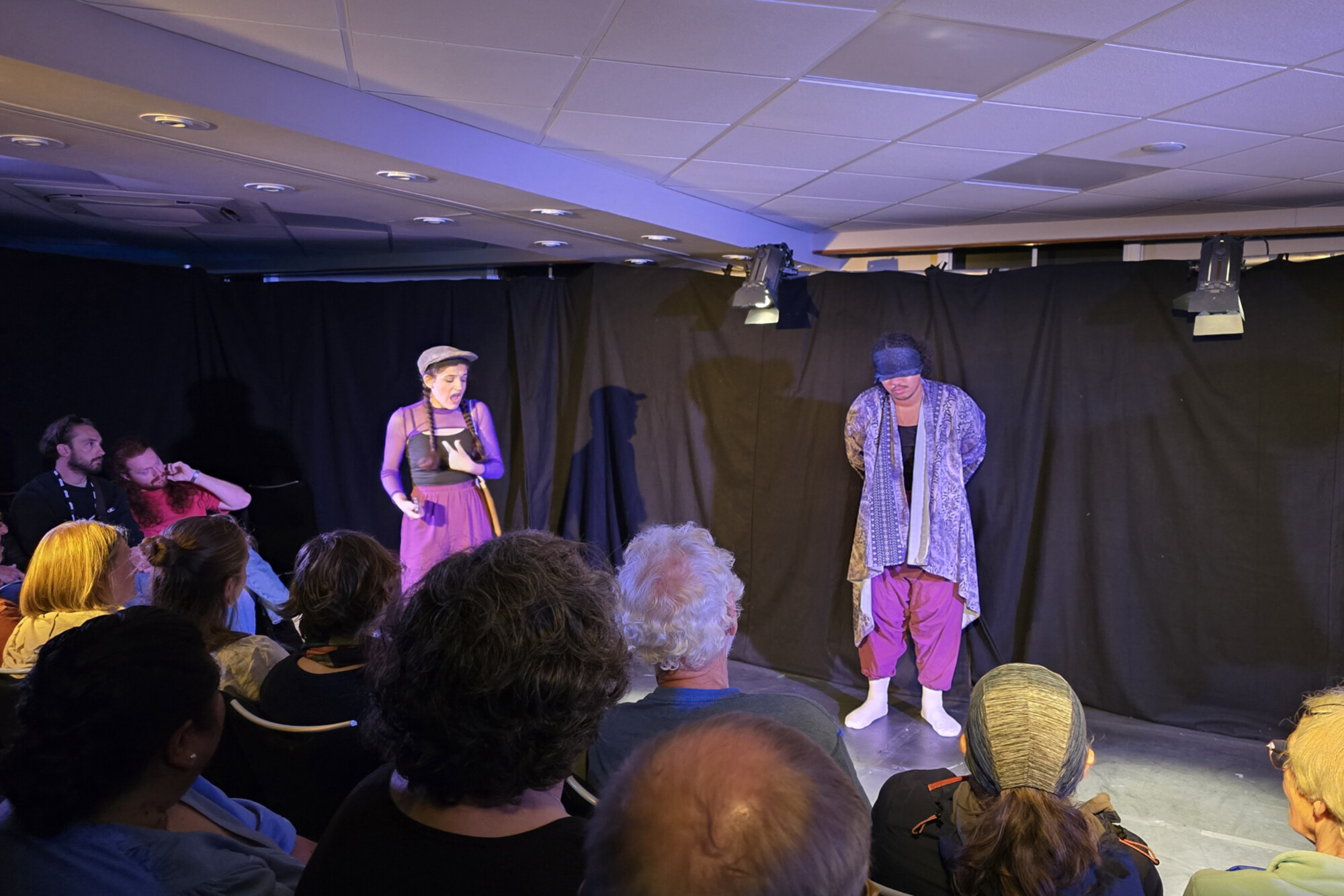 Anya Rothman and Elliot Ross-Dick performing for a crowd in Edinburgh.