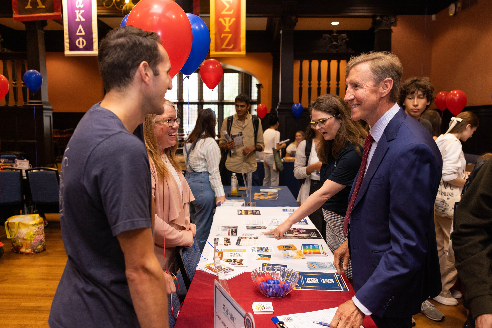 Penn President J. Larry Jameson at a table at the NSO activity fair.