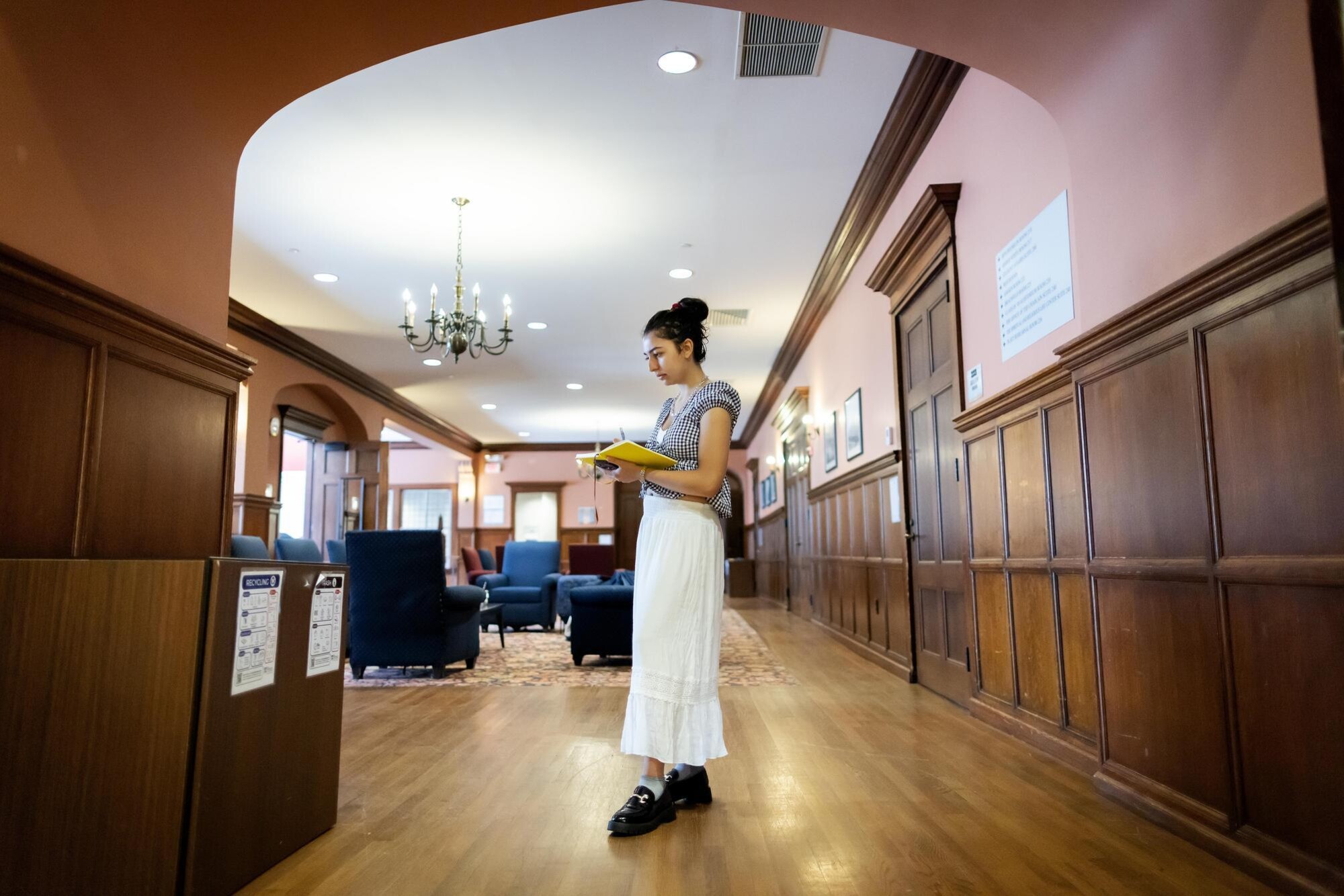 Veronica Baladi writes in a notebook in Houston Hall.