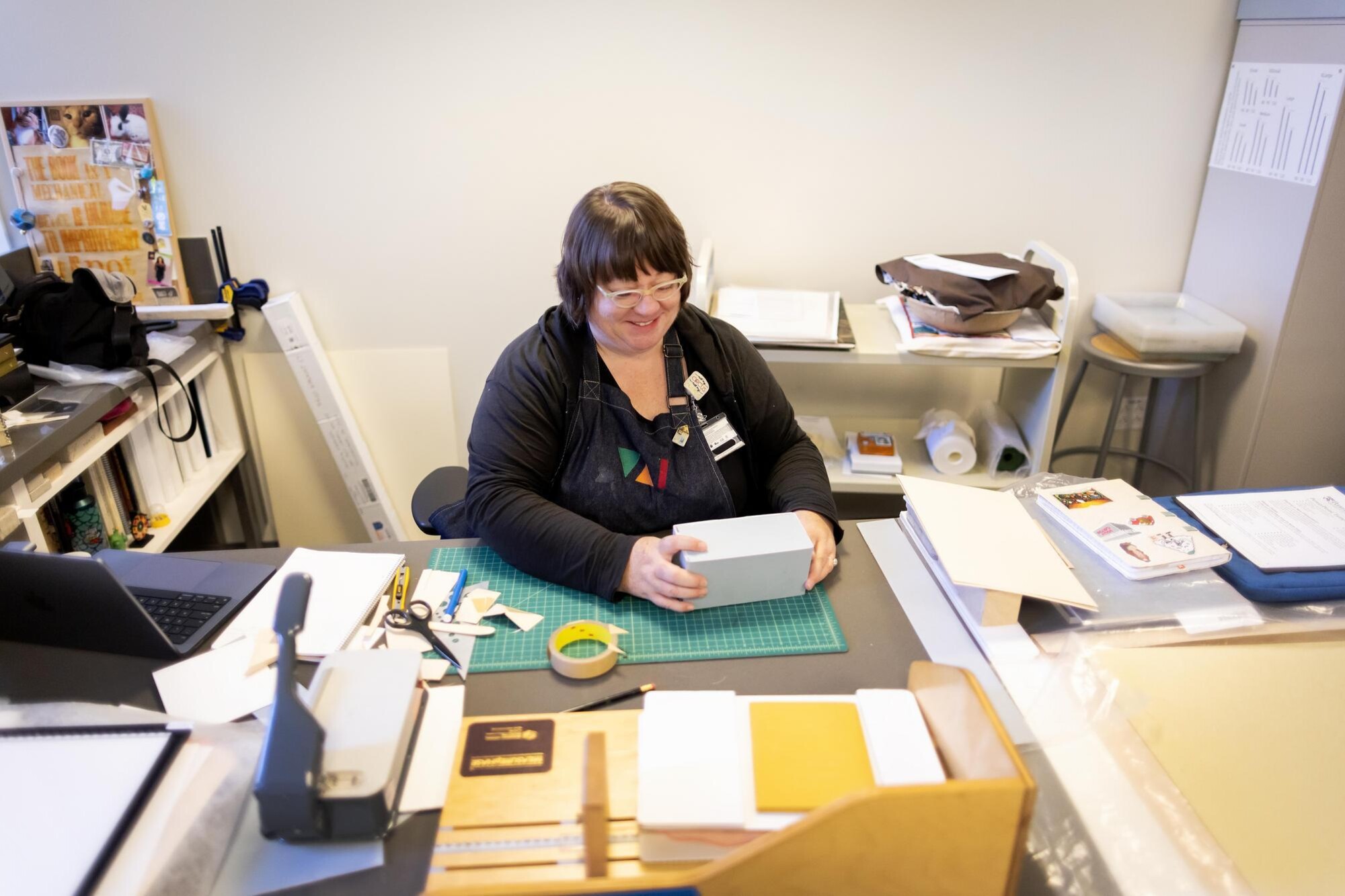 Valeria Kremser, senior conservation technician for books, fabricates new custom housings for unique artists books.