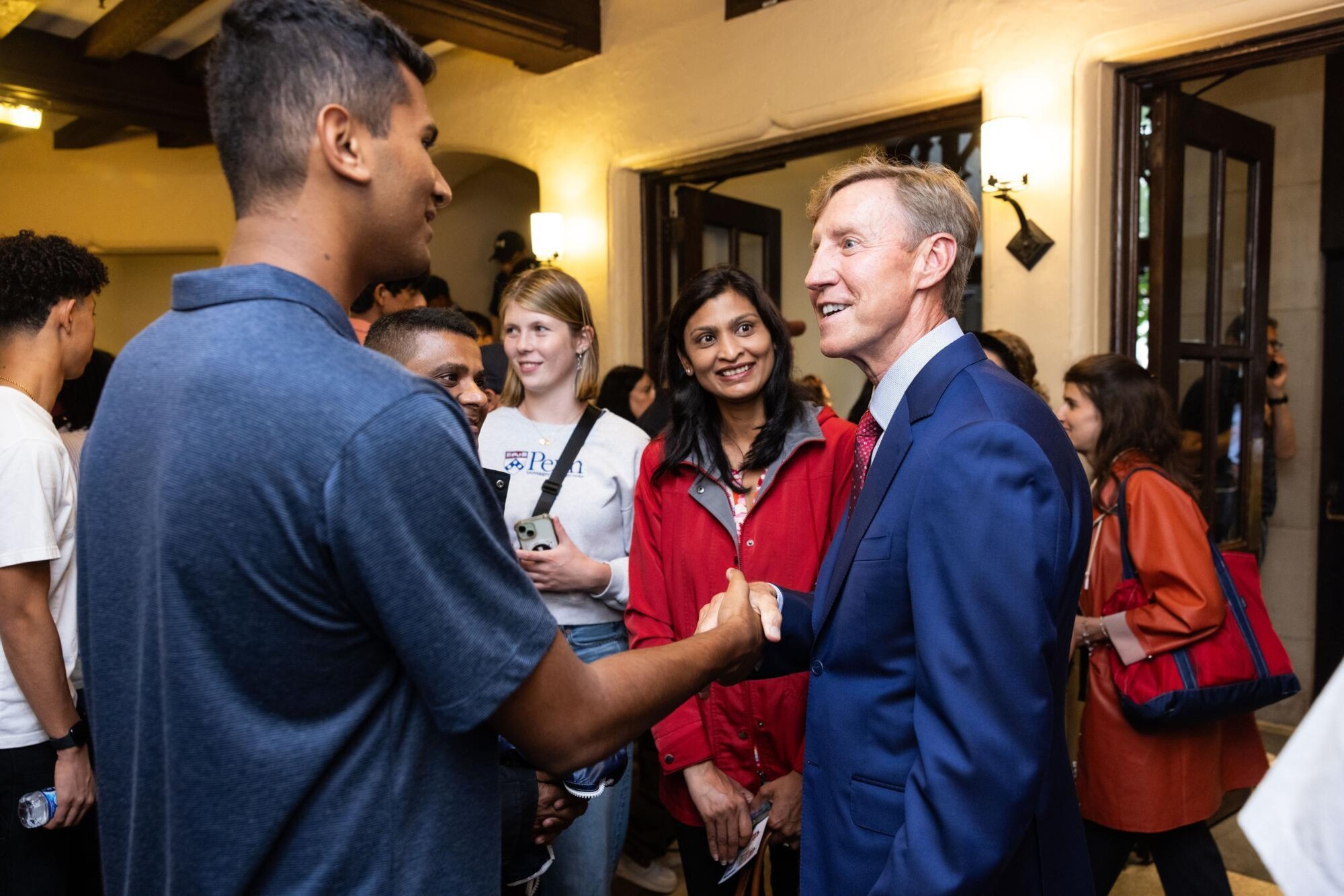 Penn President J. Larry Jameson shaking hands with a new student at the NSO event.