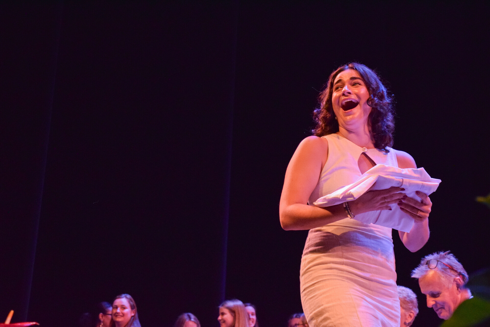 A student holding their white coat at Penn Vet’s White Coat Ceremony.