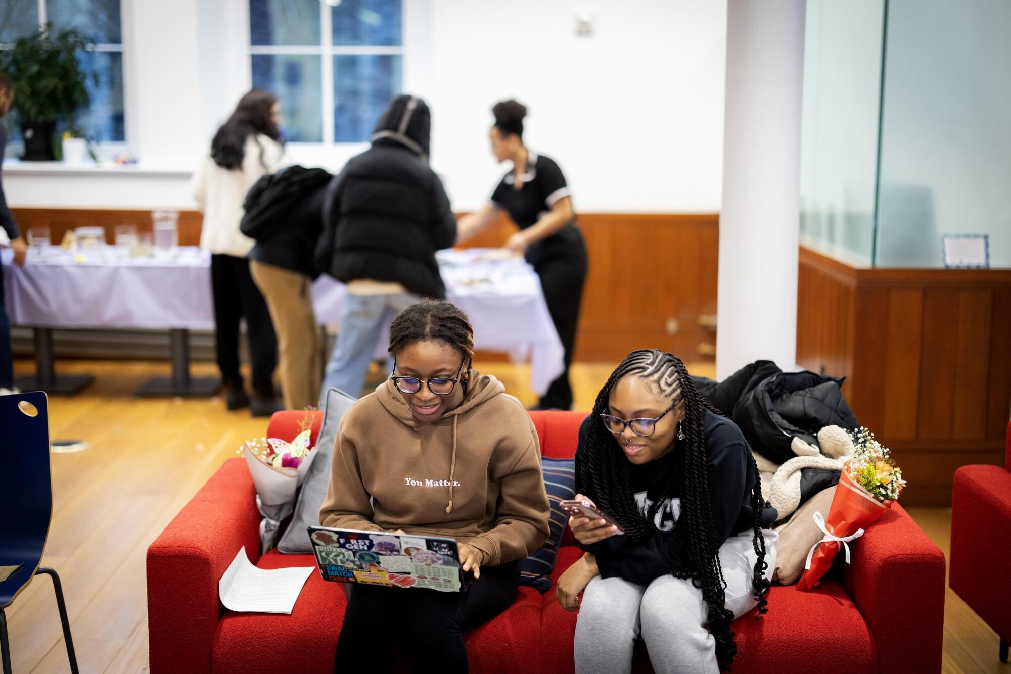 Undergraduates studying and socializing in the Penn First Plus office