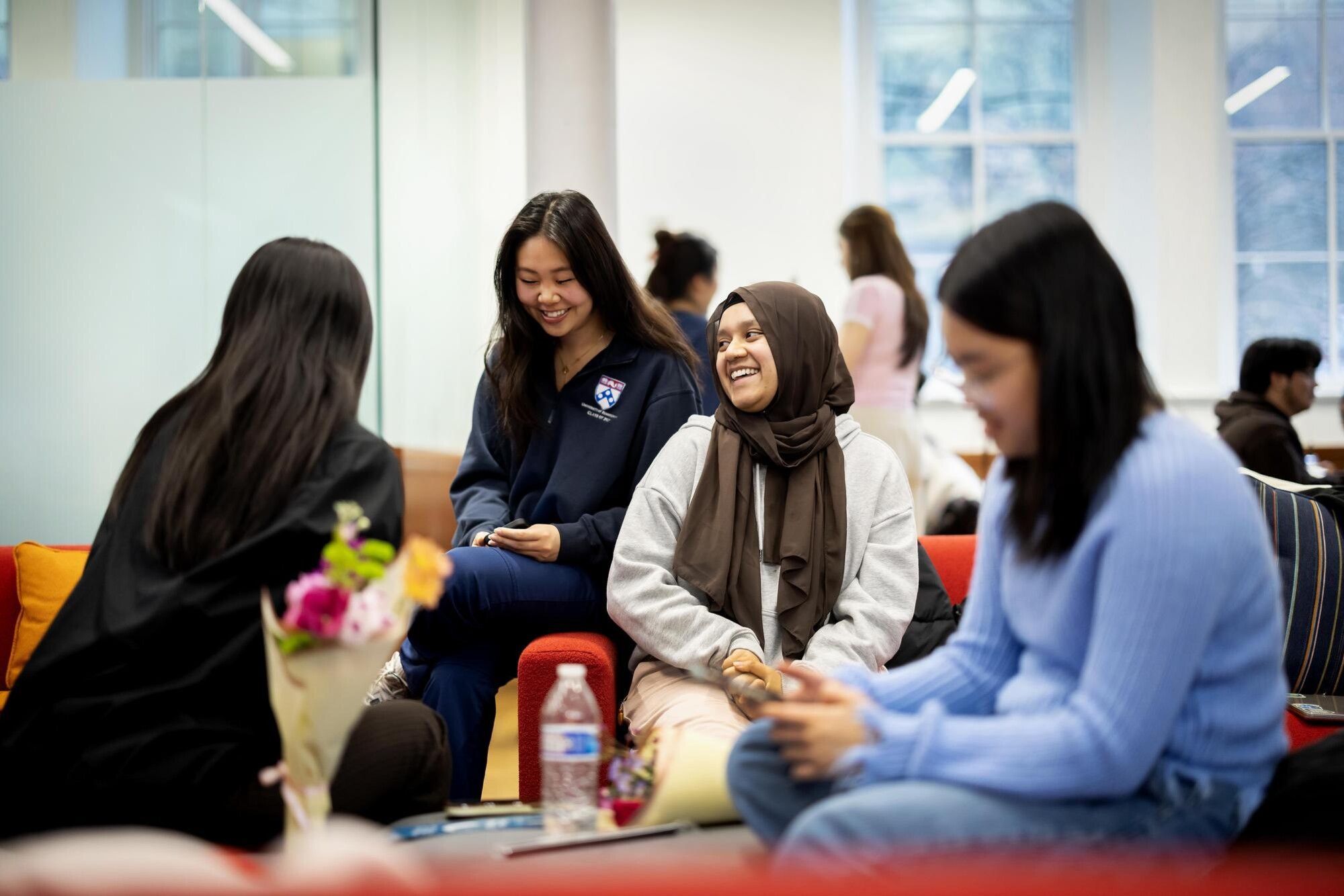 Undergraduates studying and socializing in the Penn First Plus office