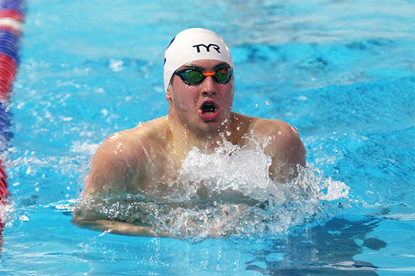Matt Fallon performs the breaststroke during a meet.