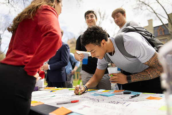 Students and staff celebrate National Student-Athlete Day on Locust Walk.