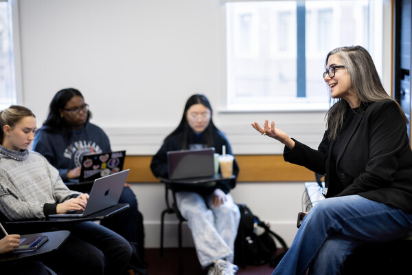 A Penn professor leading a seminar to a class of first-year students.