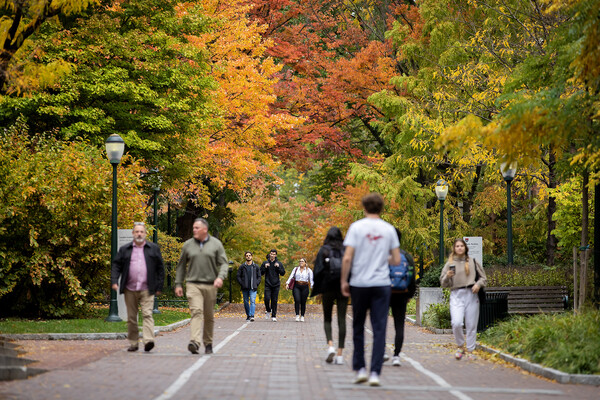 People walking along Locust Walk in the fall.