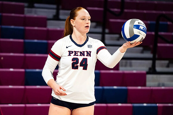 Emery Moore prepares to hit the ball during a game at the Palestra.