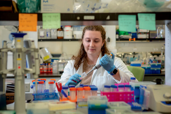 Kelsey Swingle working in a lab.