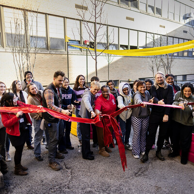 Ribbon cutting ceremony in the Breathing Room courtyard.