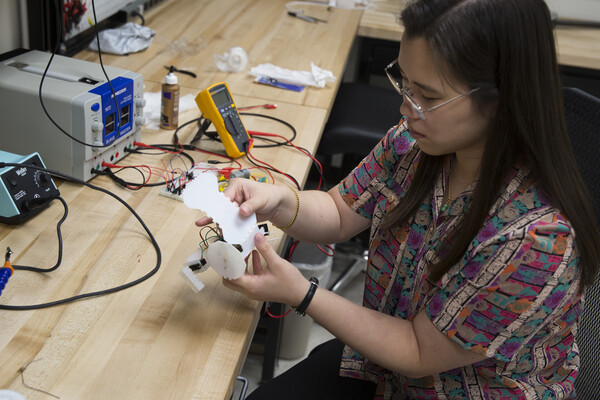 Sung is developing design software to enable people without an engineering background to create custom origami robots that can move on the ground. The tool, called Interactive Robogami, is based on a database of robot parts which users can combine together like a “virtual Lego set.”