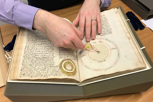 Penn Libraries curator Nicholas Herman with medieval manuscript. 