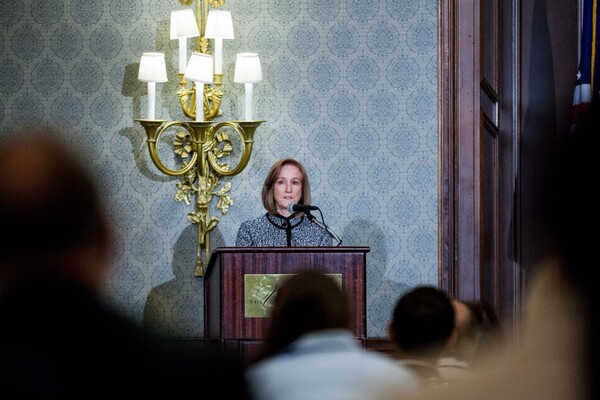 Dawn Bonnell, University of Pennsylvania's Vice Provost of Research, stands at a podium.