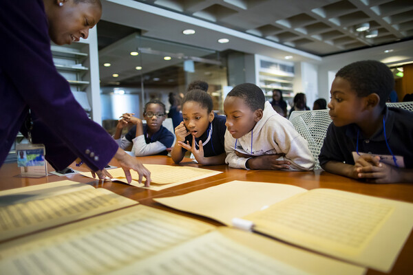 Penn-Libraries-April-James-shows-Philadelphia-elementary-school-students-sheet-music-for-Marian-Anderson-song.