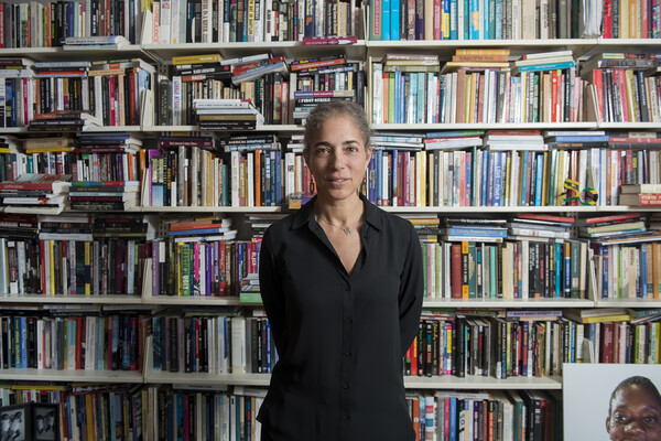 Deborah Thomas in front of bookcase