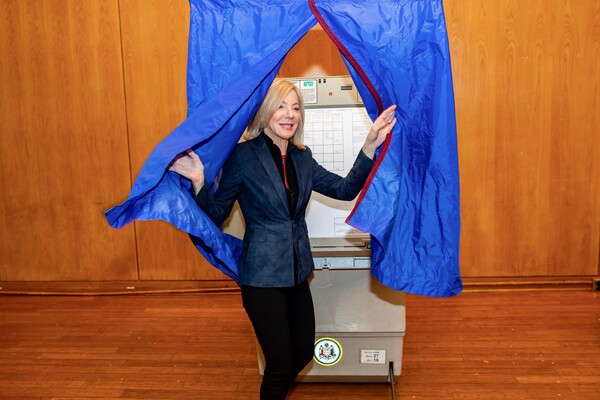 Penn President Amy Gutmann exits the voting booth