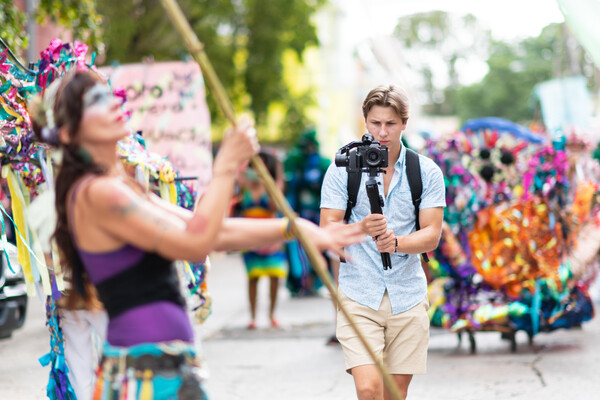 student videographer filming parade