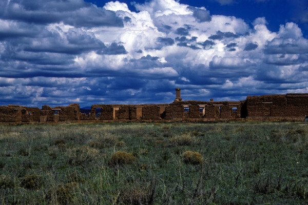 Fort Union adobe ruins with blue sky in distance