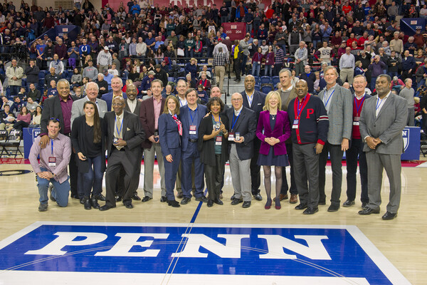 President Gutmann poses with members of the 1978-79 Final Four team.