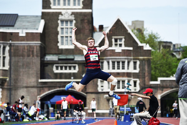 Evan Lee of the Penn track and field team performs the long jump at Franklin Field