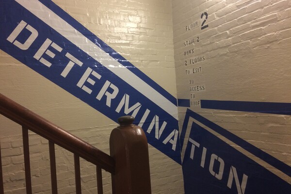 Blue stripe with Determination written on it in stairwell