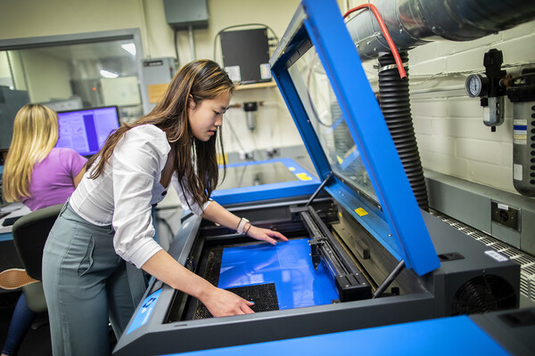 Angela Lin working in an engineering lab