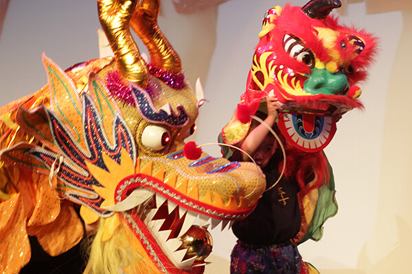 Yellow and red ornate dragon mask used in lion dance