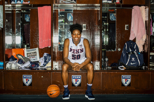 Princess Aghayere sits her her locker in the home locker room at the Palestra.