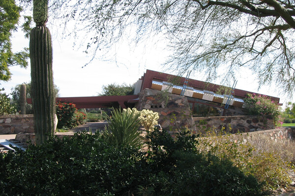 Taliesin West house exterior with cactus and trees