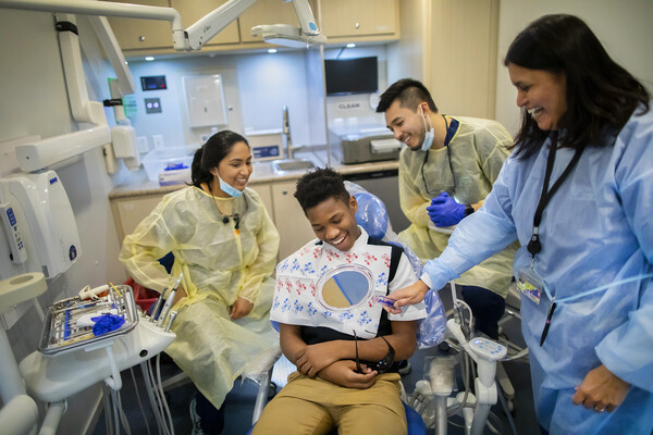 patient looking in the mirror after dental work