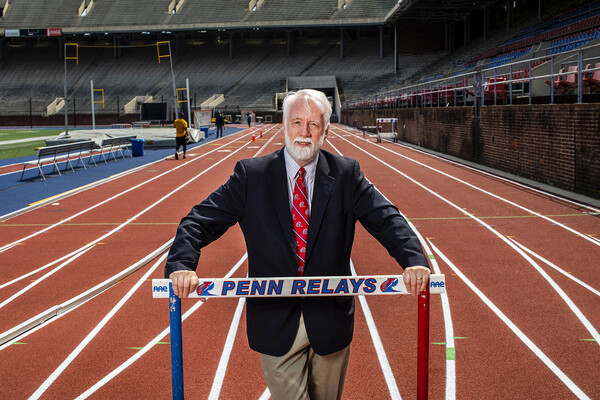 Penn Relays Director Dave Johnson poses on the track at Franklin Field.