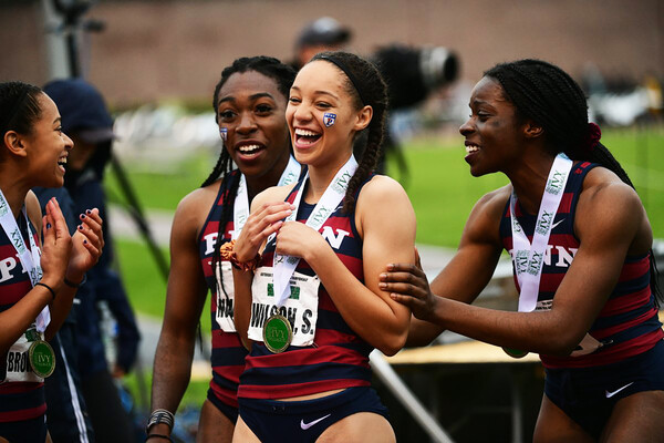 From left, Elena Brown-Soler, Uchechi Nwogwugwu, Skyla Wilson, and Cecil Ene celebrate after placing first in the 4x400.