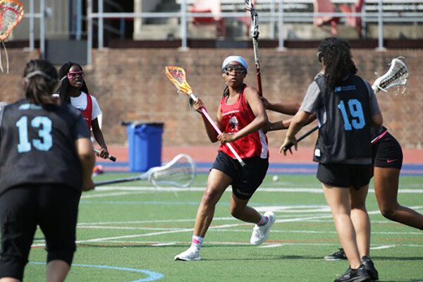 Students in the Young Quakers program play lacrosse at Franklin Field.