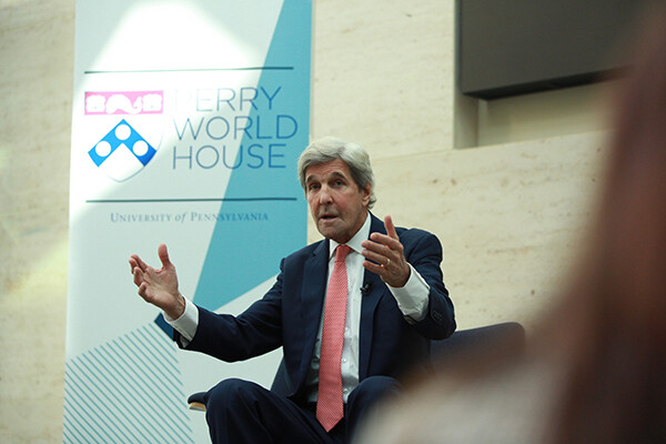 John Kerry addresses the crowd while seated on stage at the Perry World House Fall Colloquium