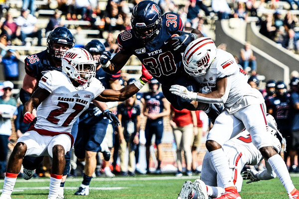 At Franklin Field against Sacred Heart, junior running back Karekin Brooks dives into the endzone. 