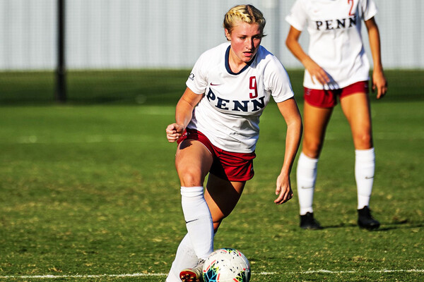 Against Dartmouth, freshman Sizzy Lawton dribbles the ball down the field.
