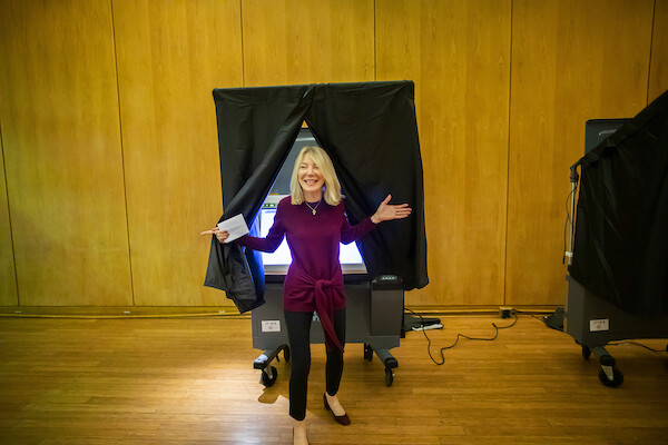 Penn President Amy Gutmann exits the voting booth at Vance Hall 